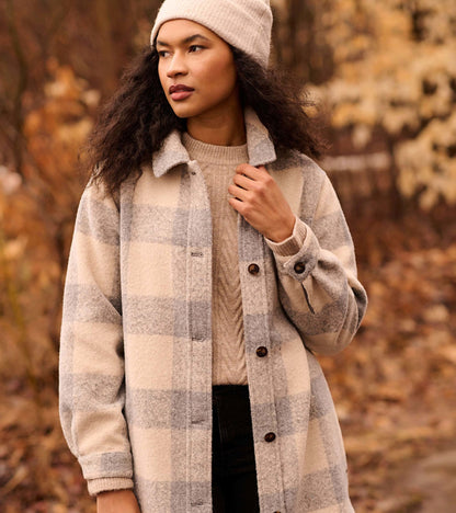 Neutral plaid overshirt in soft fabric, featuring a button-up front and relaxed fit, perfect for layering in cooler weather.
