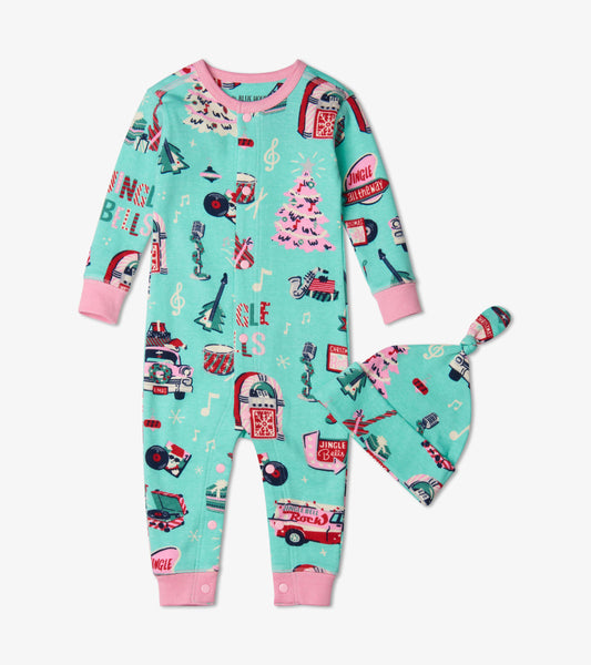 Teal baby coverall with festive prints and matching hat, featuring pink accents and long sleeves.