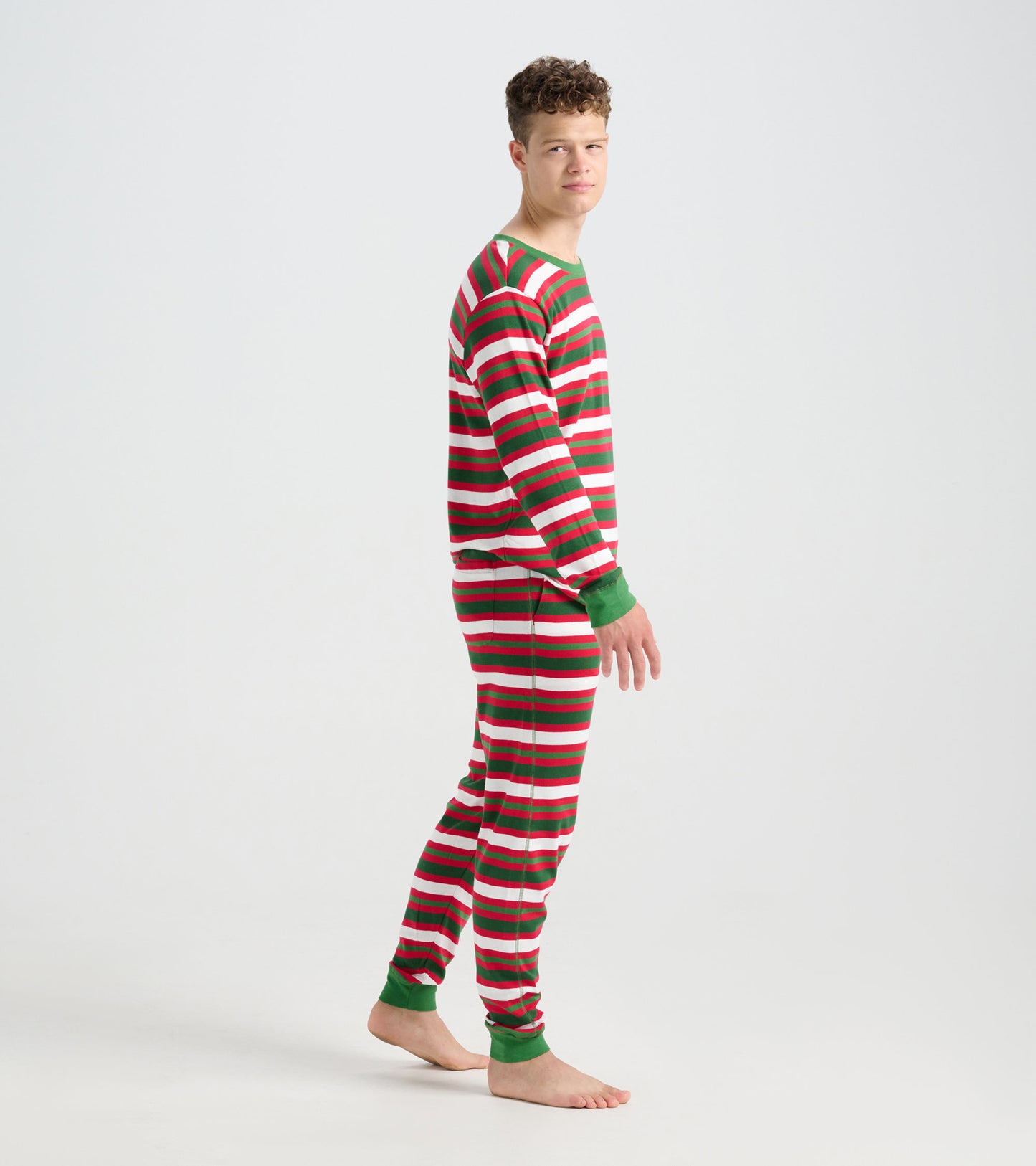 Men's pajama set featuring red, green, and white candy cane stripes, long sleeves, and matching pants.