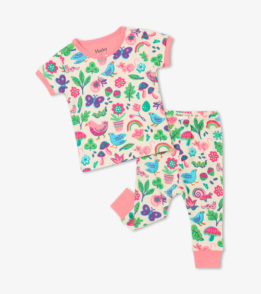 Short sleeve pajama set featuring a colorful floral and animal print on soft organic cotton.