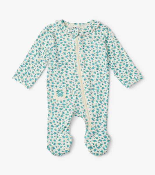 Light blue footed sleeper with ruffle neck, featuring a butterfly pattern and a front zipper for easy dressing.