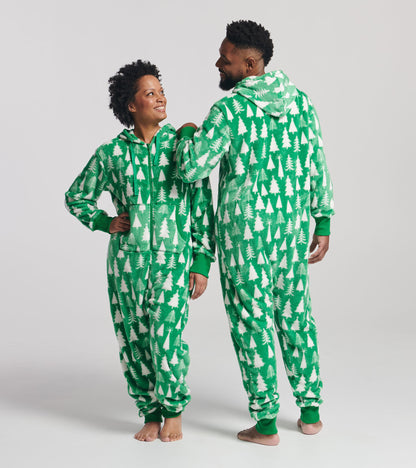 Green hooded fleece jumpsuit featuring a white tree pattern, worn by two people standing side by side.