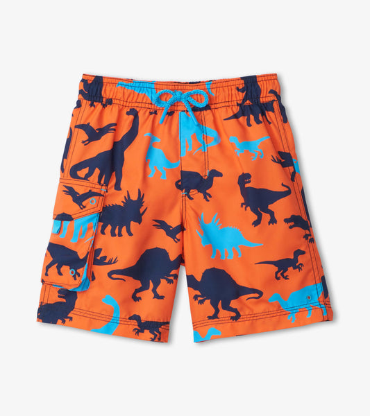 Orange board shorts featuring blue dinosaur silhouettes, with a side pocket and drawstring waist.