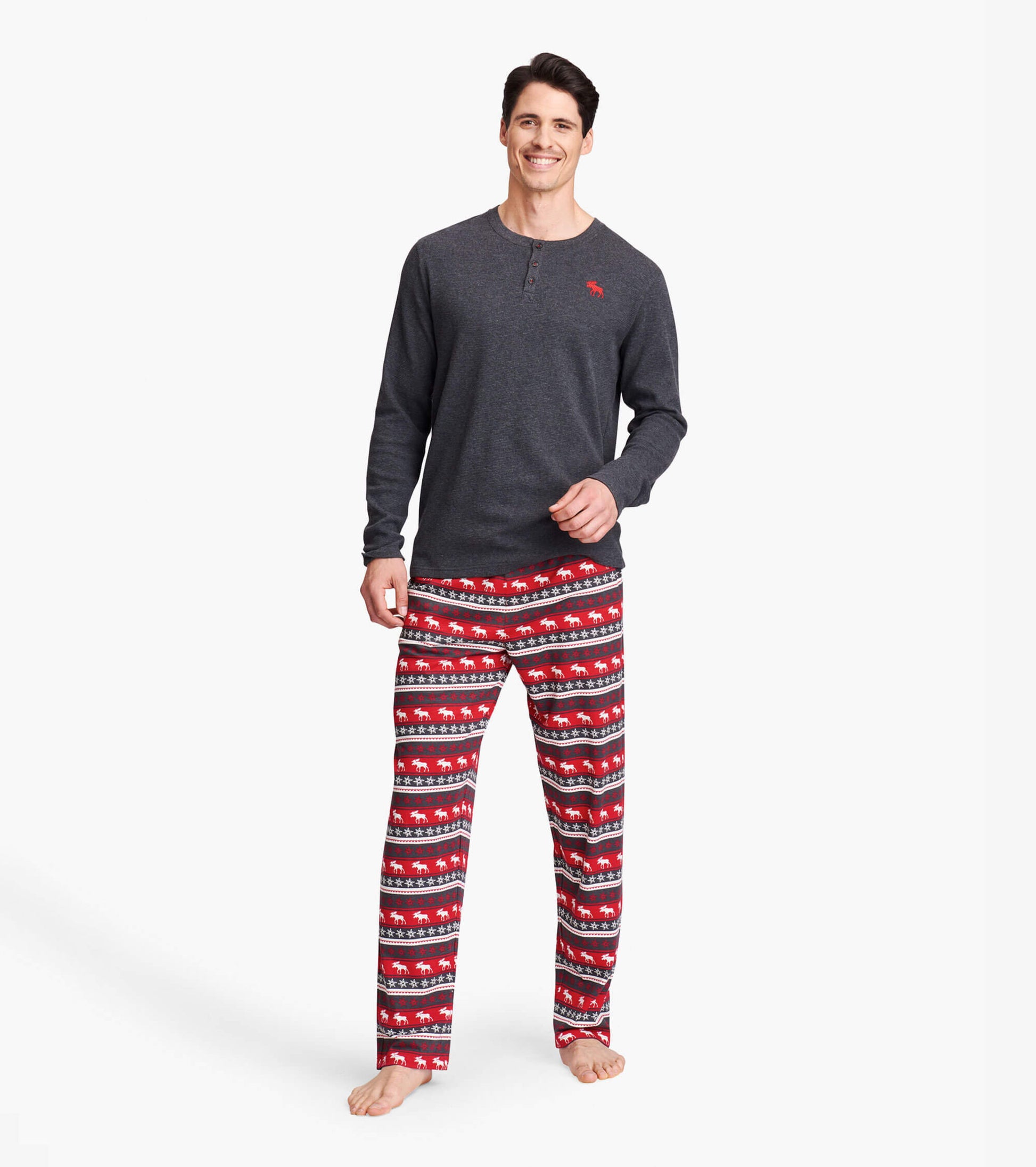 Men's stretch cotton pajama pants featuring a red and black Fair Isle moose pattern, perfect for lounging.