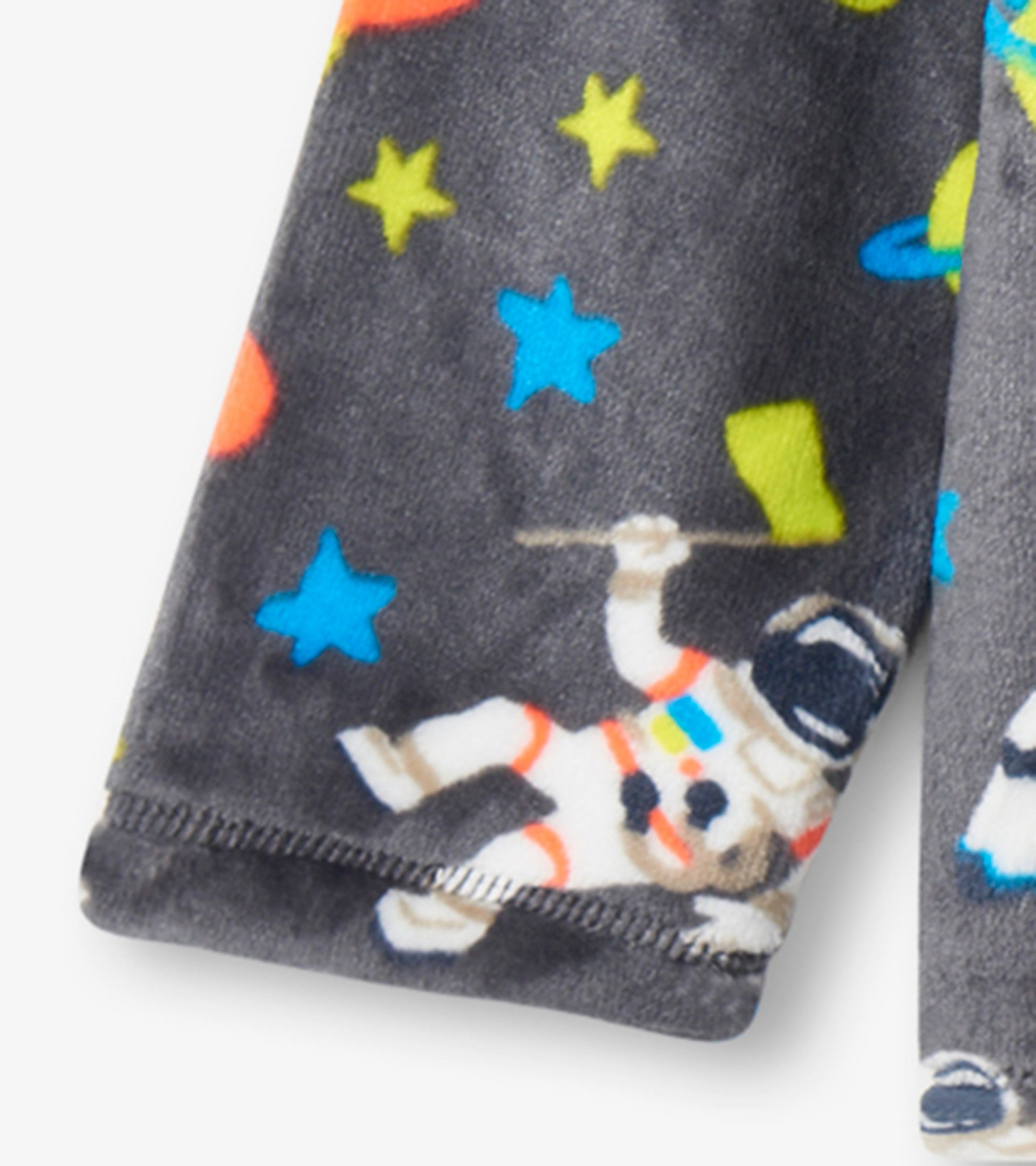 Gray fleece jacket featuring colorful astronaut and star patterns, perfect for kids.