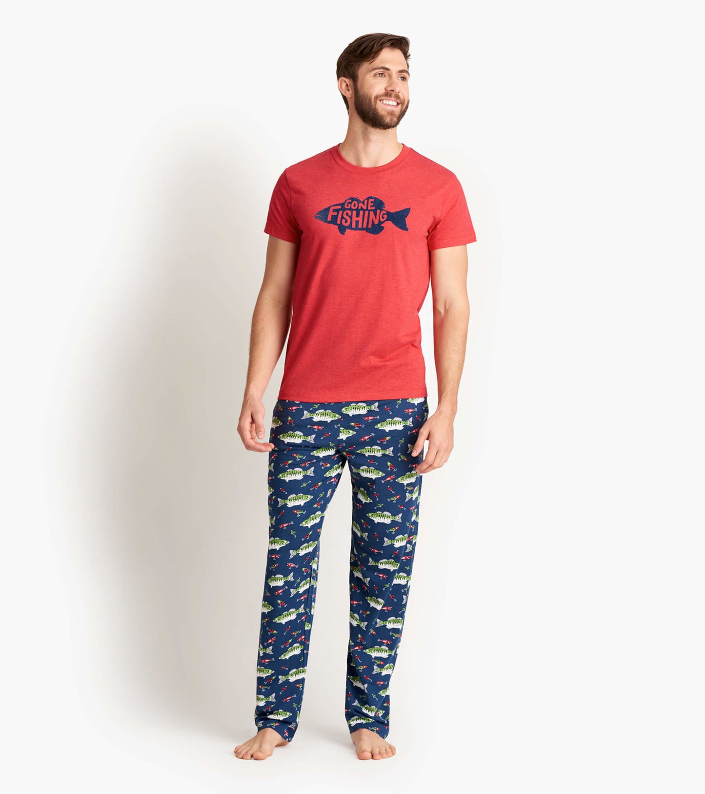 Red short-sleeve tee with "Gone Fishing" graphic, paired with navy pants featuring colorful fish and fishing motifs.