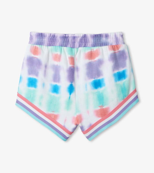 Multicolored tie-dye French terry jogging shorts with a striped hem and elastic waistband.