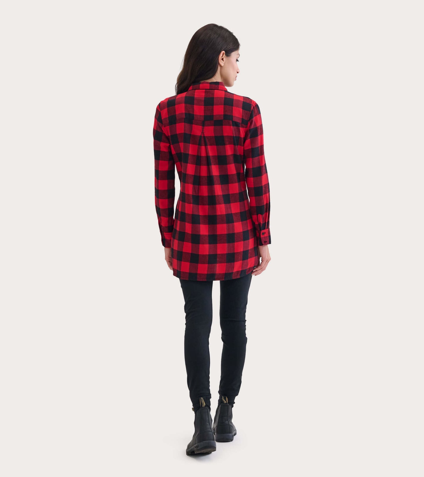 Red and black plaid flannel tunic with long sleeves and a relaxed fit, viewed from the back.
