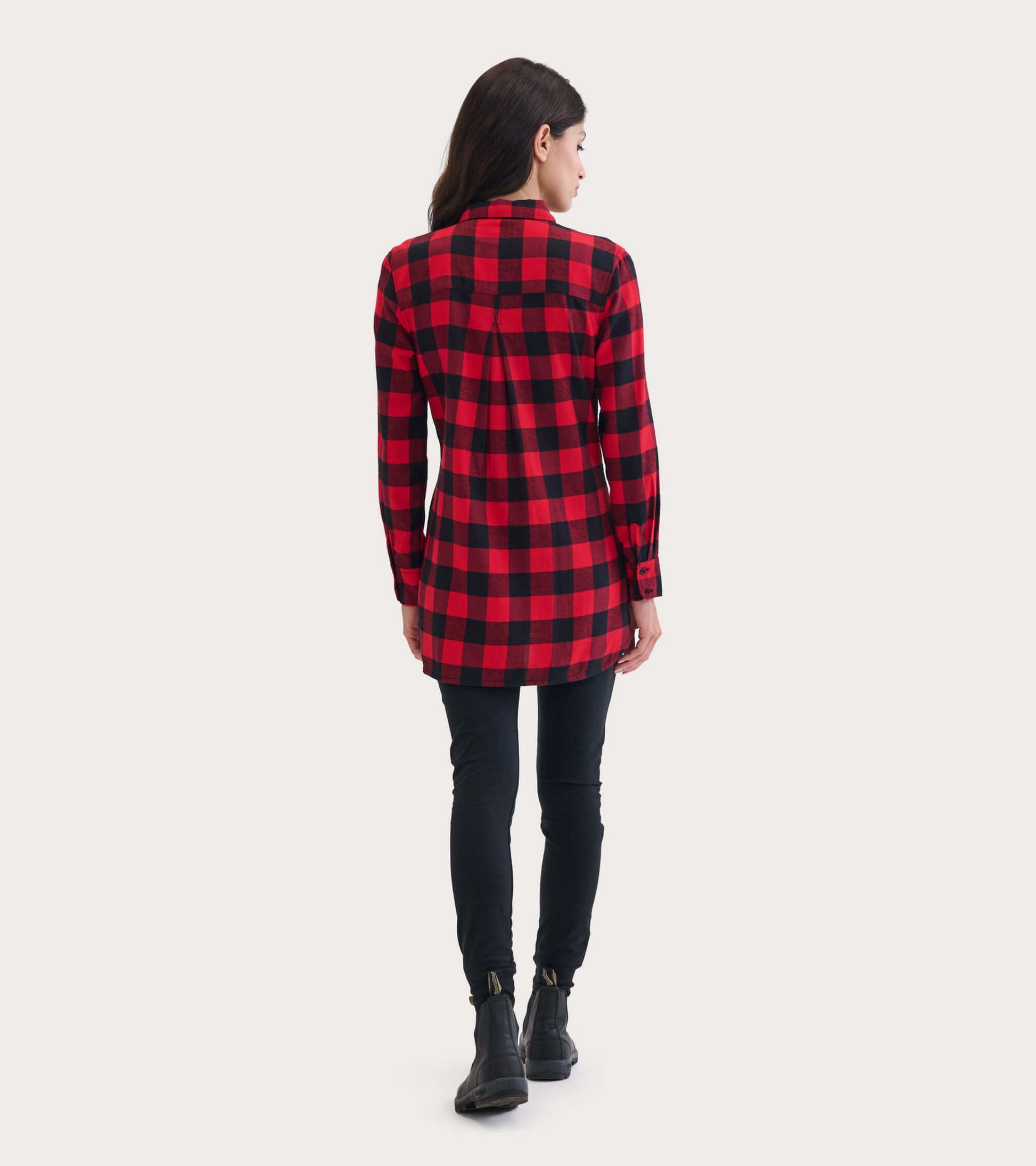 Red and black plaid flannel tunic with long sleeves and a relaxed fit, viewed from the back.