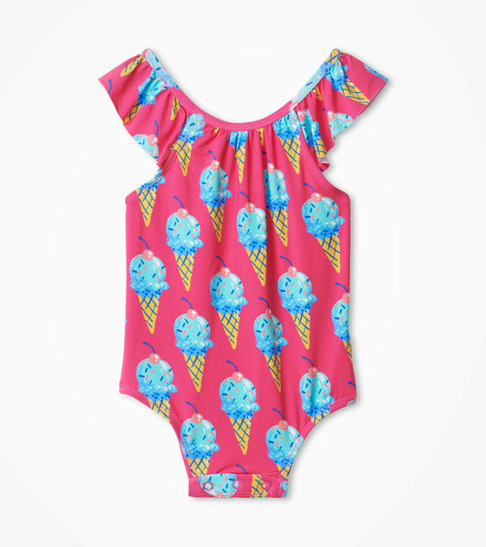 Pink swimsuit with ruffled sleeves, featuring a colorful ice cream cone pattern. Suitable for babies.