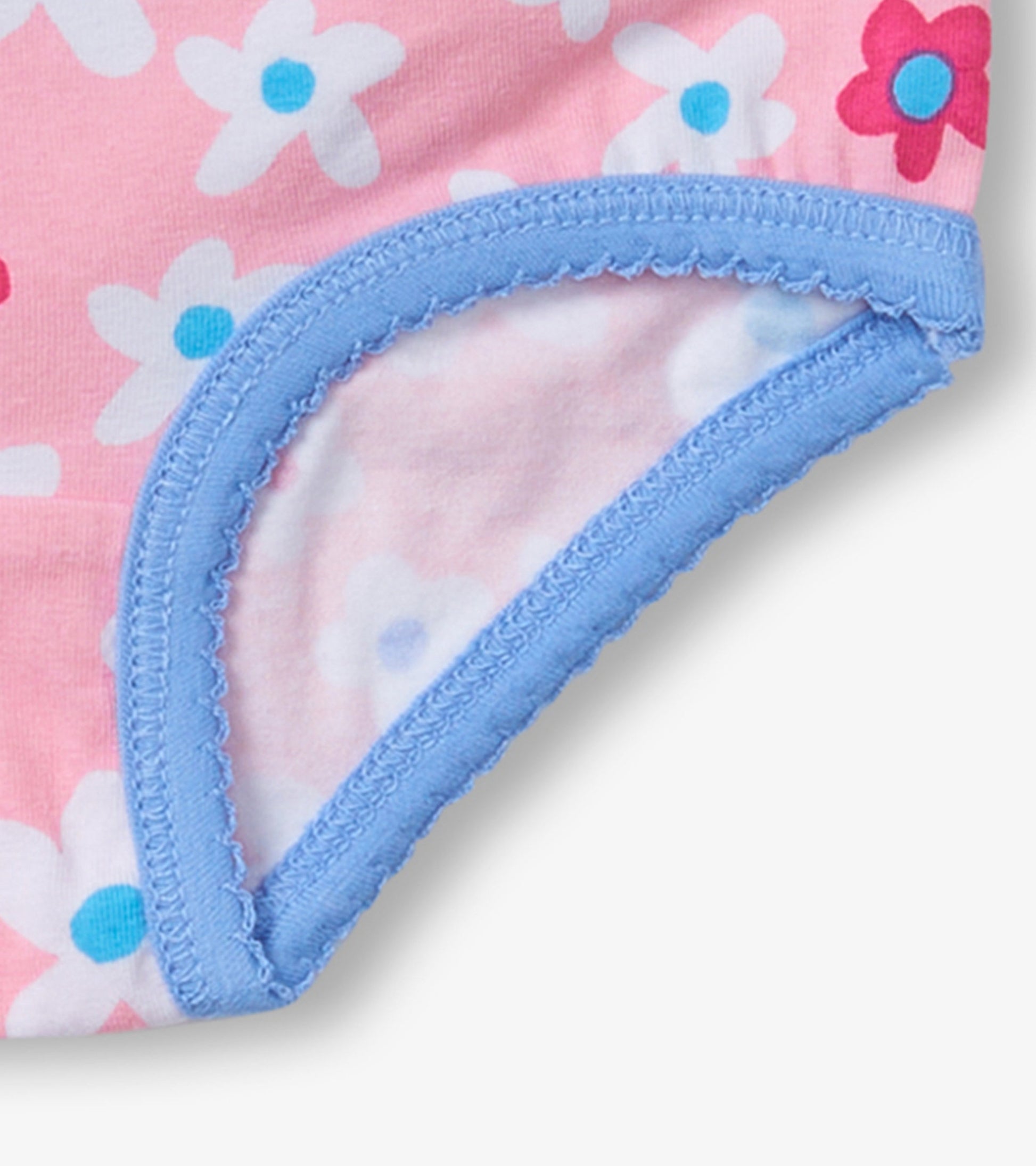 Pink hipster underwear with floral pattern and blue trim, showcasing soft cotton material and comfortable design.