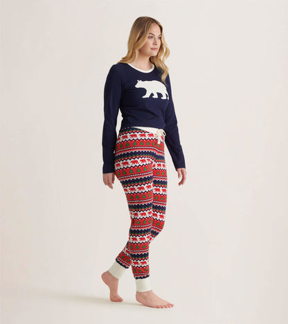 Navy long sleeve pajama top with white polar bear graphic, paired with festive patterned pants in red, white, and blue.