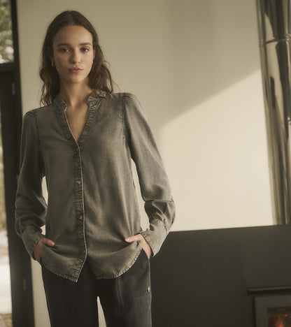 Black acid wash blouse with a button-down front and long sleeves, styled with a relaxed fit.