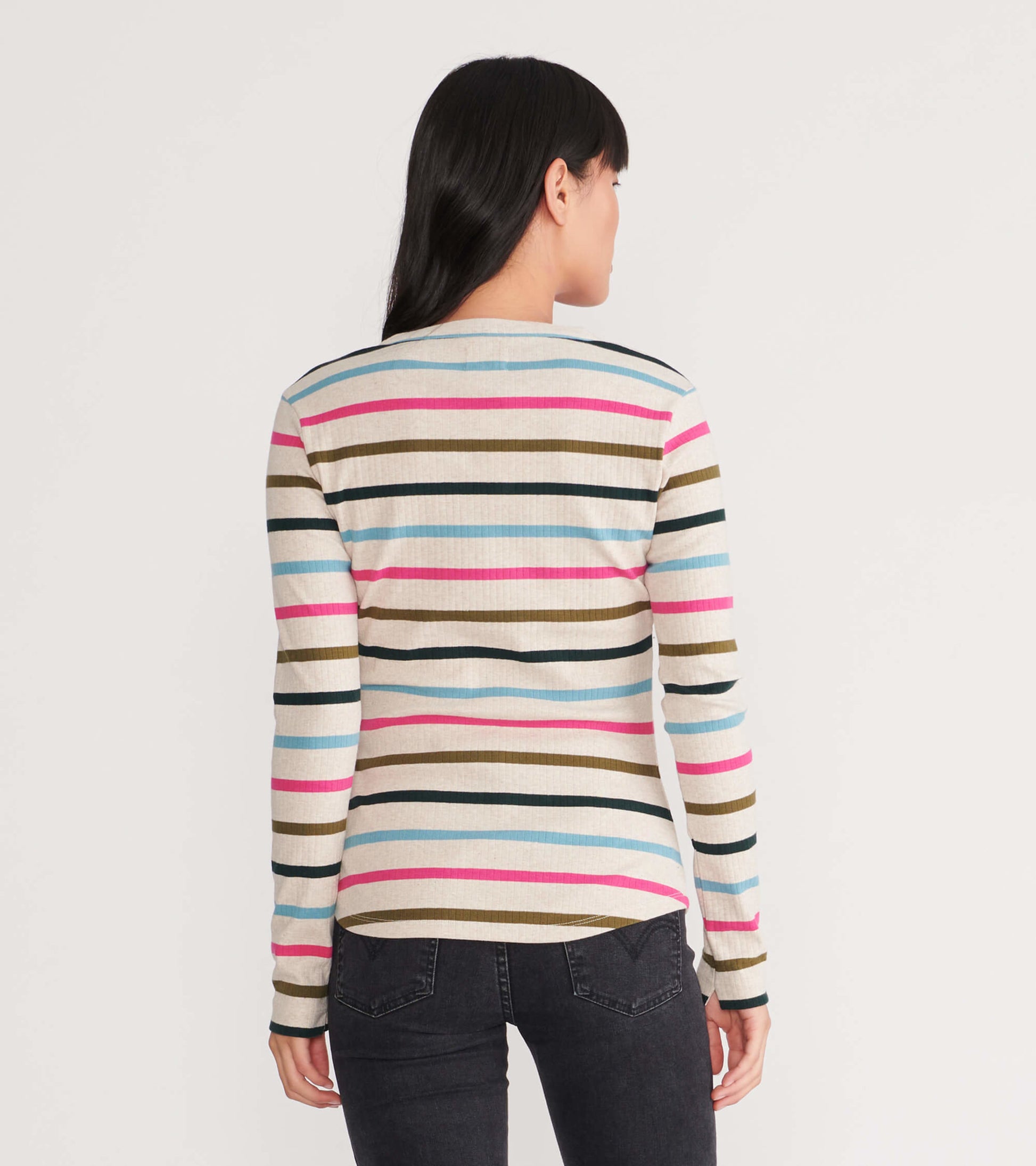 Long-sleeve henley featuring a multicolored striped pattern on a light background, viewed from the back.