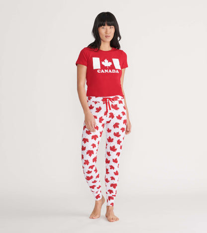 Red short-sleeve tee featuring a white Canada graphic, paired with white pants adorned with red maple leaf patterns.