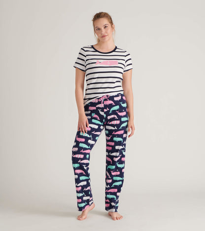 Striped short-sleeve tee with whale graphic paired with navy pajama pants featuring colorful whale patterns.
