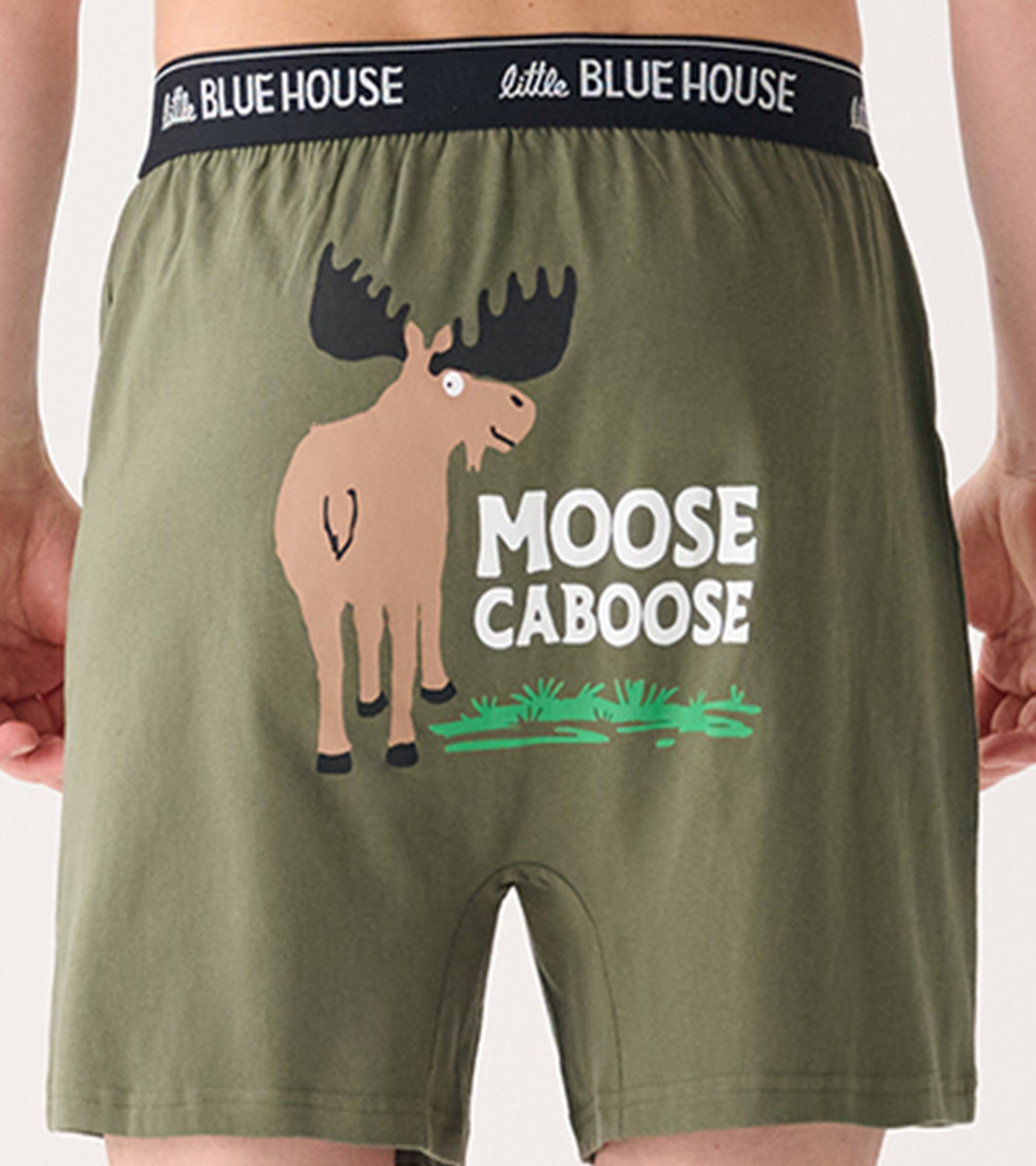 Olive green boxer shorts featuring a moose graphic and the text "MOOSE CABOOSE" on the back.