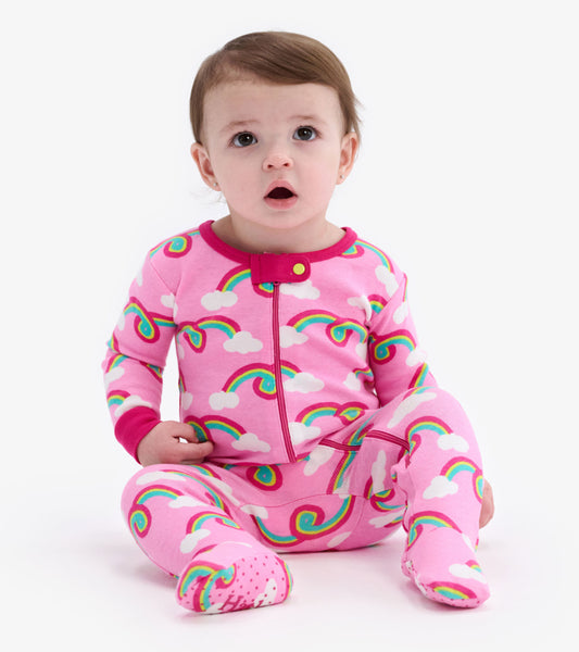 Pink footed sleeper featuring colorful rainbows and clouds, designed for infants, with a front zipper closure.