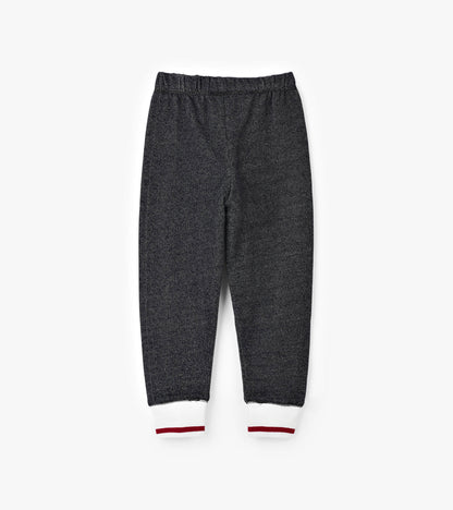 Charcoal gray joggers with a soft texture and white/red striped cuffs, featuring an elastic waistband for comfort.