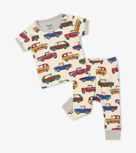 Short sleeve pajama set in cream with colorful vintage car print, made from organic cotton, includes matching pants.
