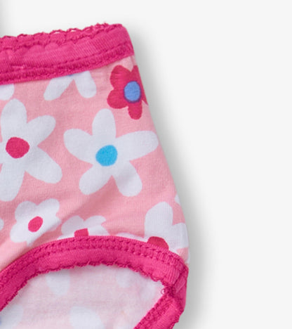 Pink girls' brief underwear featuring a floral pattern and a ruffled waistband, ideal for everyday wear.