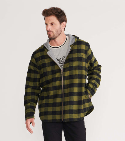 Men's flannel jacket in green and black plaid, featuring a hood and zip closure, styled with a gray shirt underneath.