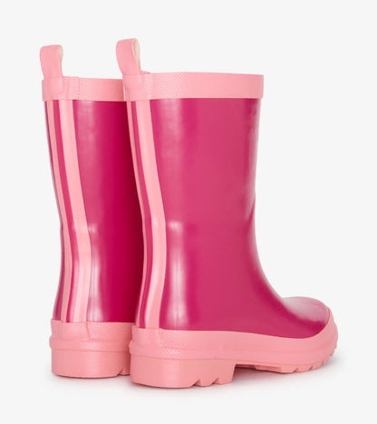 Bright pink shiny rain boots with a smooth finish and contrasting pink stripes, designed for kids.
