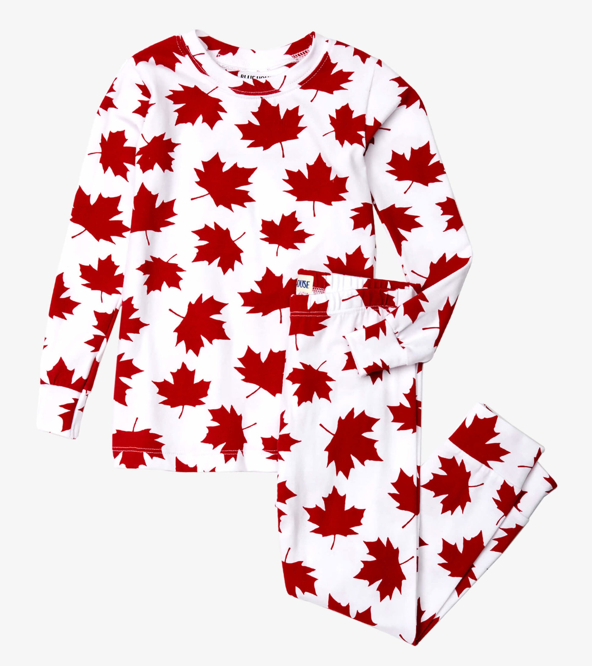 Red maple leaf pattern on white fabric, long-sleeve top and matching pants, suitable for kids' sleepwear.