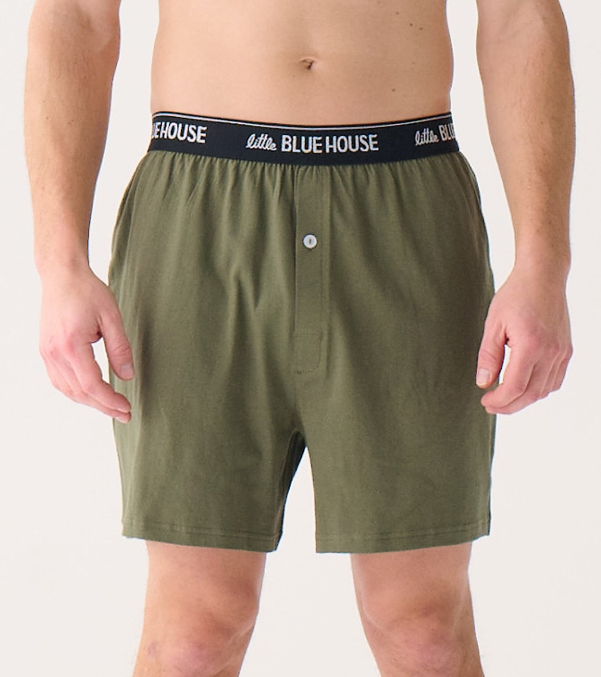Men's olive green boxer shorts with a black elastic waistband and button fly, shown from the front.