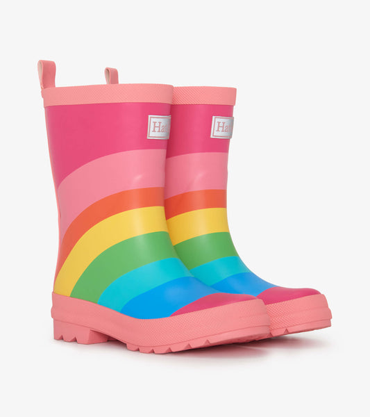Colorful matte rain boots featuring a pink base with a rainbow pattern, designed for kids.